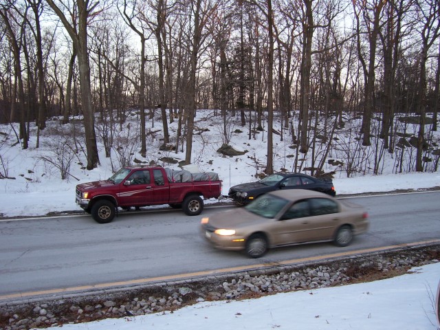 The chase cars--note the tow bars behind the pick up