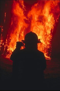 Firefighter attacking the flames